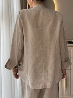 Two-piece Set Featuring A Casual Knit Cotton Top With Cut-out Details And Contrasting Color Trims, Paired With Linen-cotton Blend Trousers.