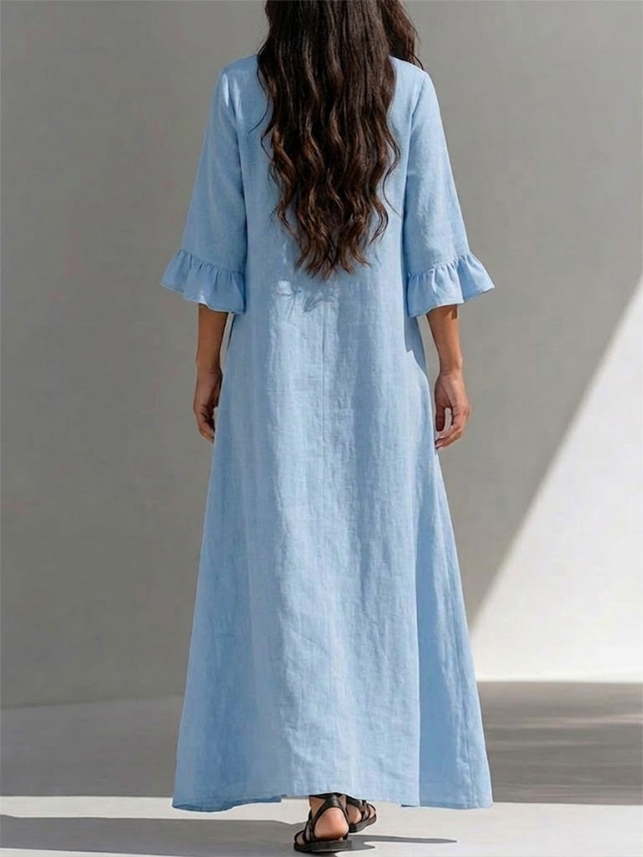 Long Dress Featuring A Partial Button-front, Gathered Details, Ruffled Three-quarter Sleeves, And A Flattering, Figure-concealing Fit