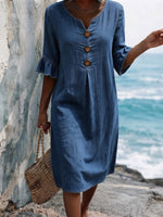 Solid-color Cotton Dress Featuring A V-neck, Three Wooden Buttons, Front Pleats, And Flattering Ruffled Mid-length Sleeves
